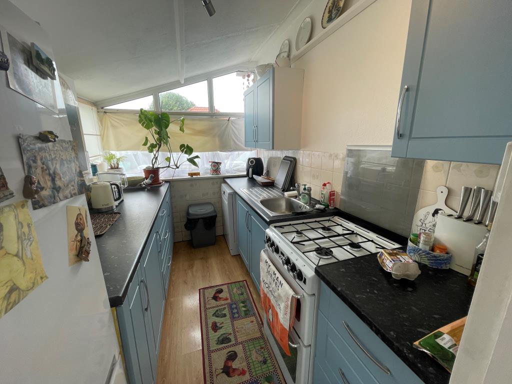 Lot: 8 - BUNGALOW WITH PLANNING FOR EXTENSION AND NEW BUILD TWO-BEDROOM BUNGALOW - Bedroom with window looking to garden